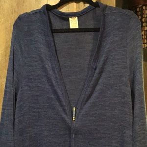 Long blue sweater with pockets.